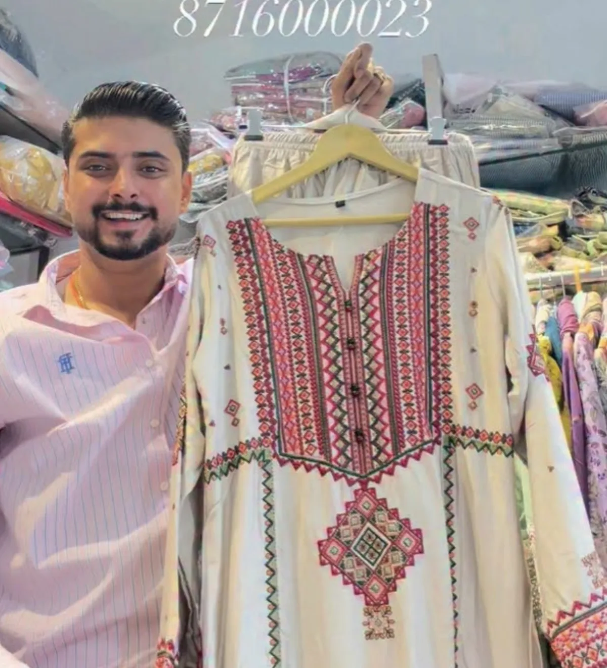 Ivory kurta with a red and black geometric yoke