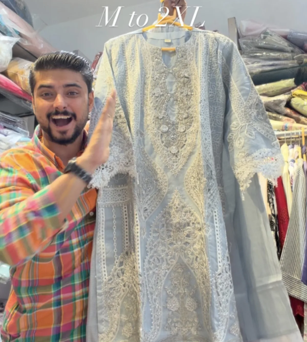 Pale blue kurta covered in white chikankari embroidery