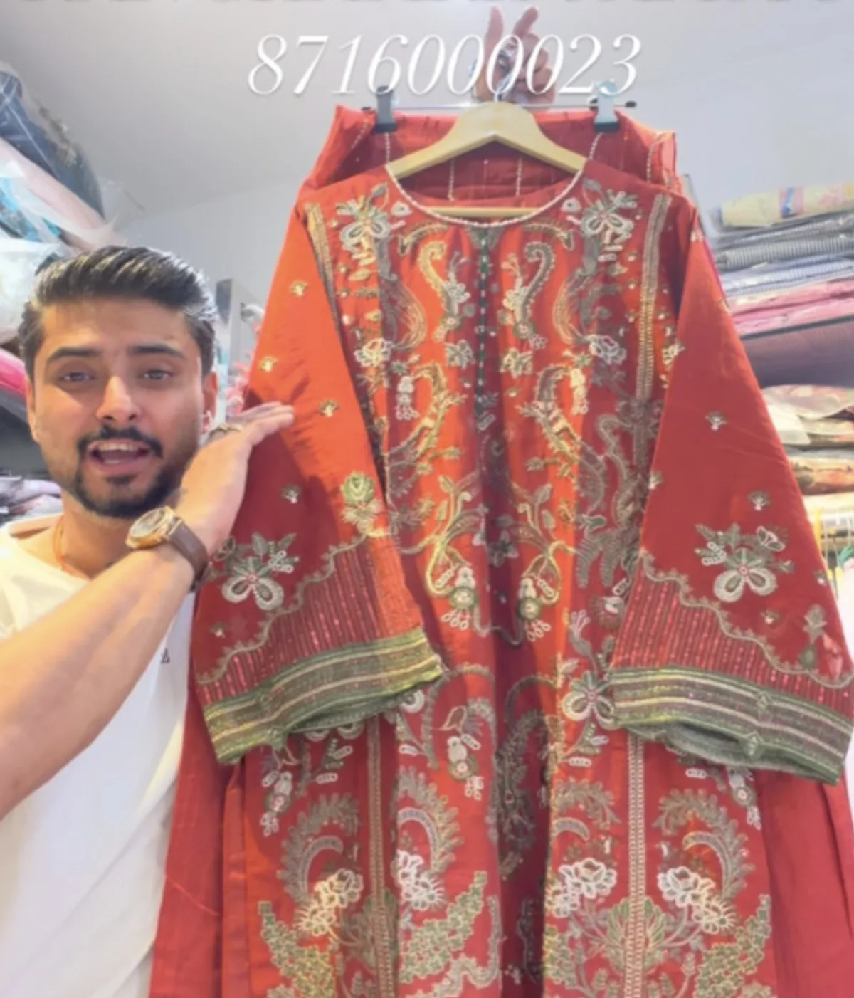 Rust red kurta with heavy gold and green embroidery