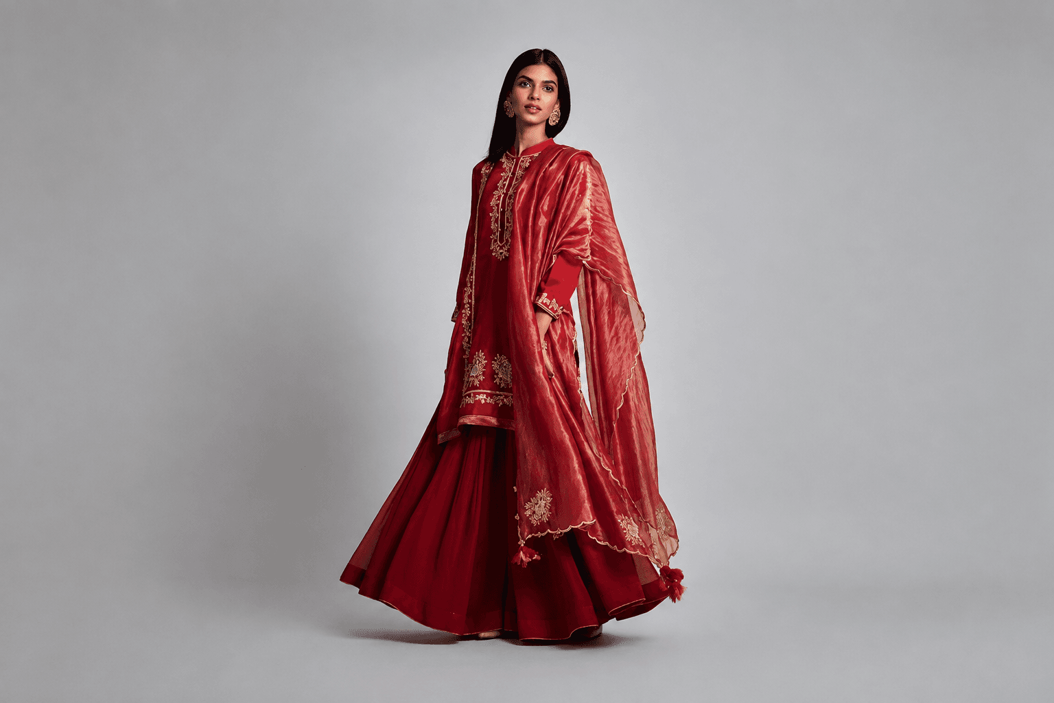 Model in a crimson embroidered set